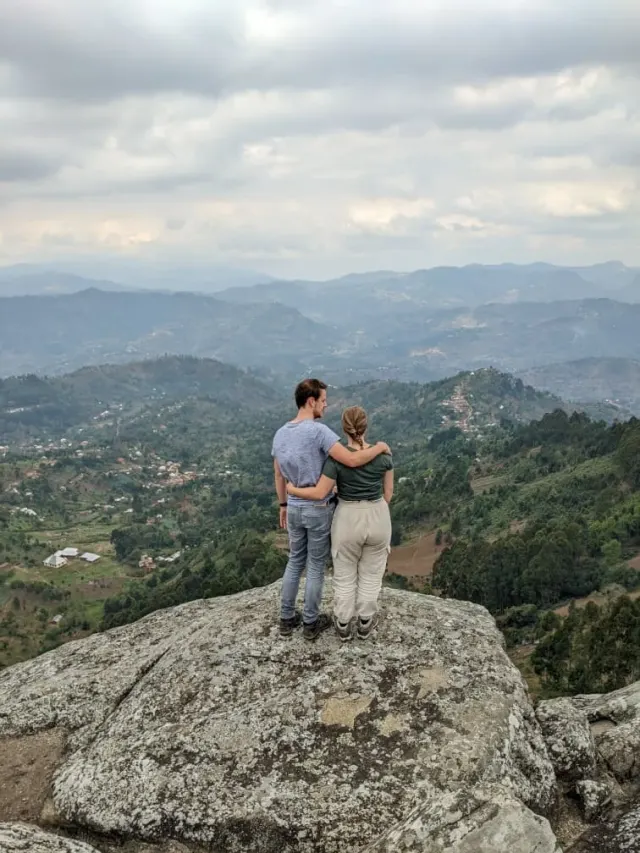 A couple at a mountain top taking in the long view over the Usambara hills and villages